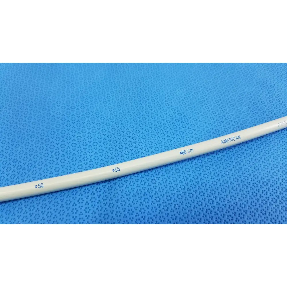 White plastic american endoscopy 27fr maloney tapered tungsten filled esophageal bougie with blue measurement markings