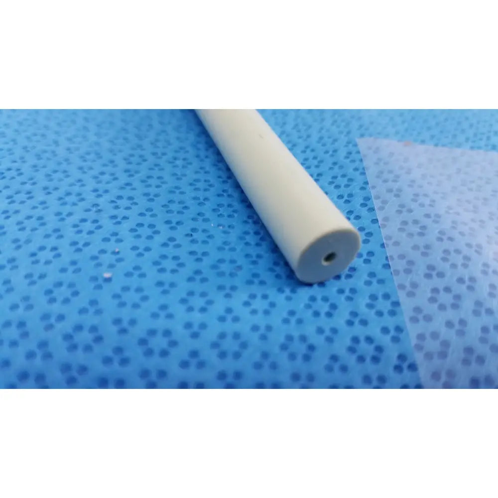A beige tungsten-filled american endoscopy 27fr maloney tapered esophageal bougie with small hole on blue surface