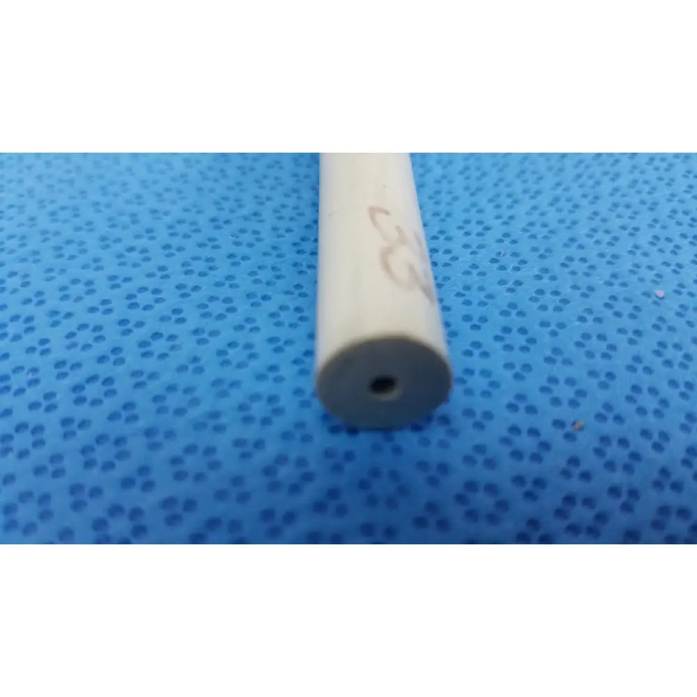 A beige cylindrical american endoscopy 33fr maloney tapered tungsten-filled esophageal bougie with small hole