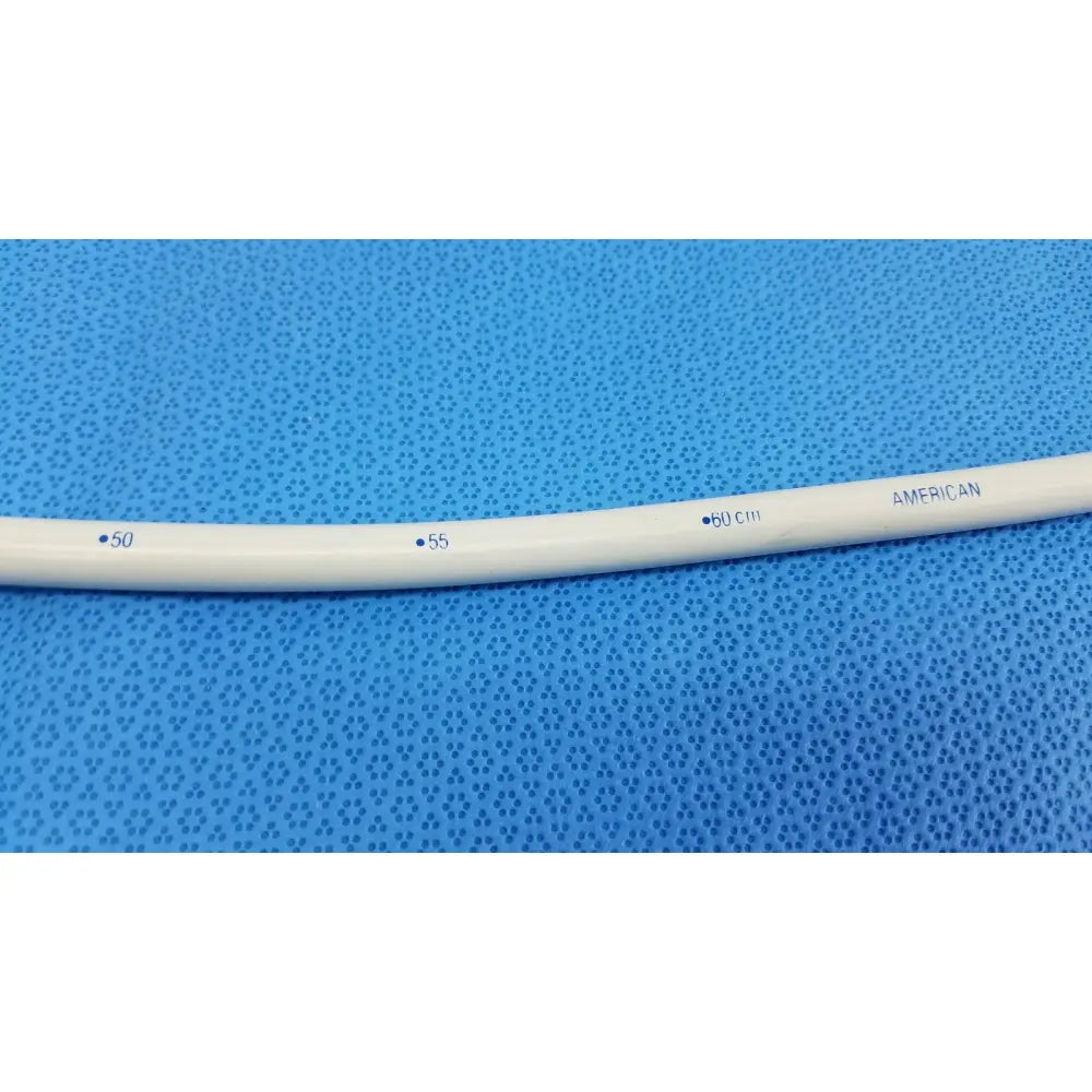 White plastic endoscopy 33fr maloney tapered tungsten filled esophageal bougie tube marked with centimeter measurements american