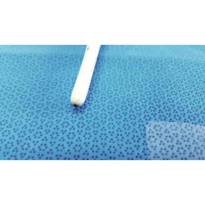 White plastic earbud with rounded tip resting on blue perforated surface beside american endoscopy 60fr maloney tapered esophageal bougie
