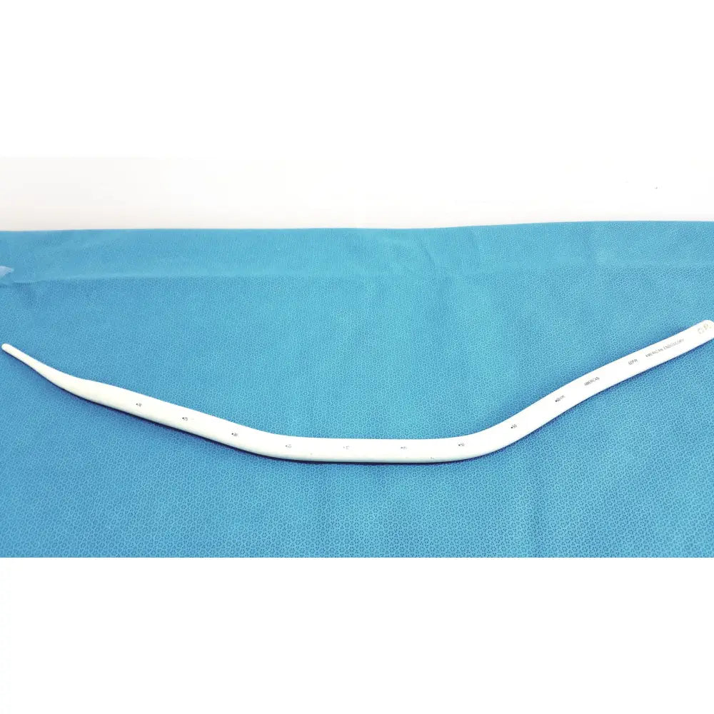 White curved medical airway tube with smooth plastic and perforations in american endoscopy 60fr maloney bougie