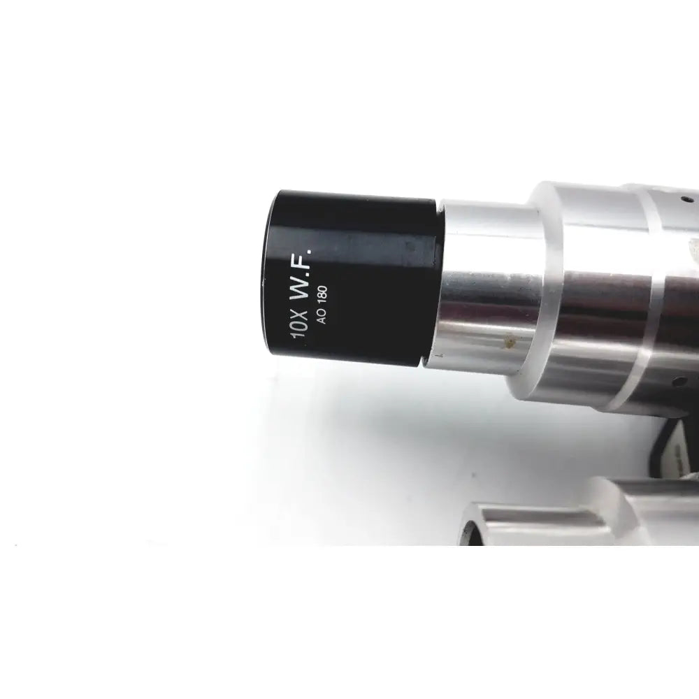 Black and silver 10x w.f. microscope objective lens of american optical microstar 110 120 binocular head with eyepieces