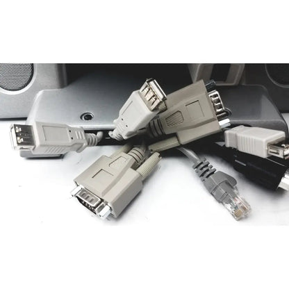 The back side of american telecare lifeview home video patient monitor showing tangled gray and black cables with usb vga and ethernet ports