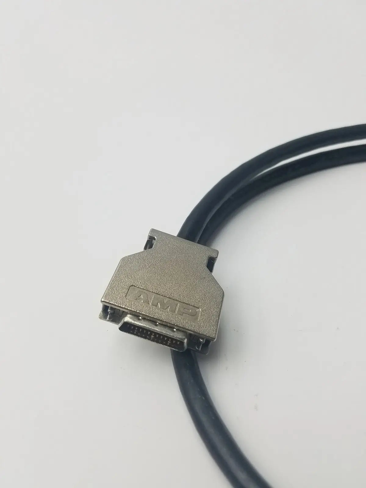 Silver-colored amp scsi cable with 26-pin vhdi connector and black cable for high-speed data transfer