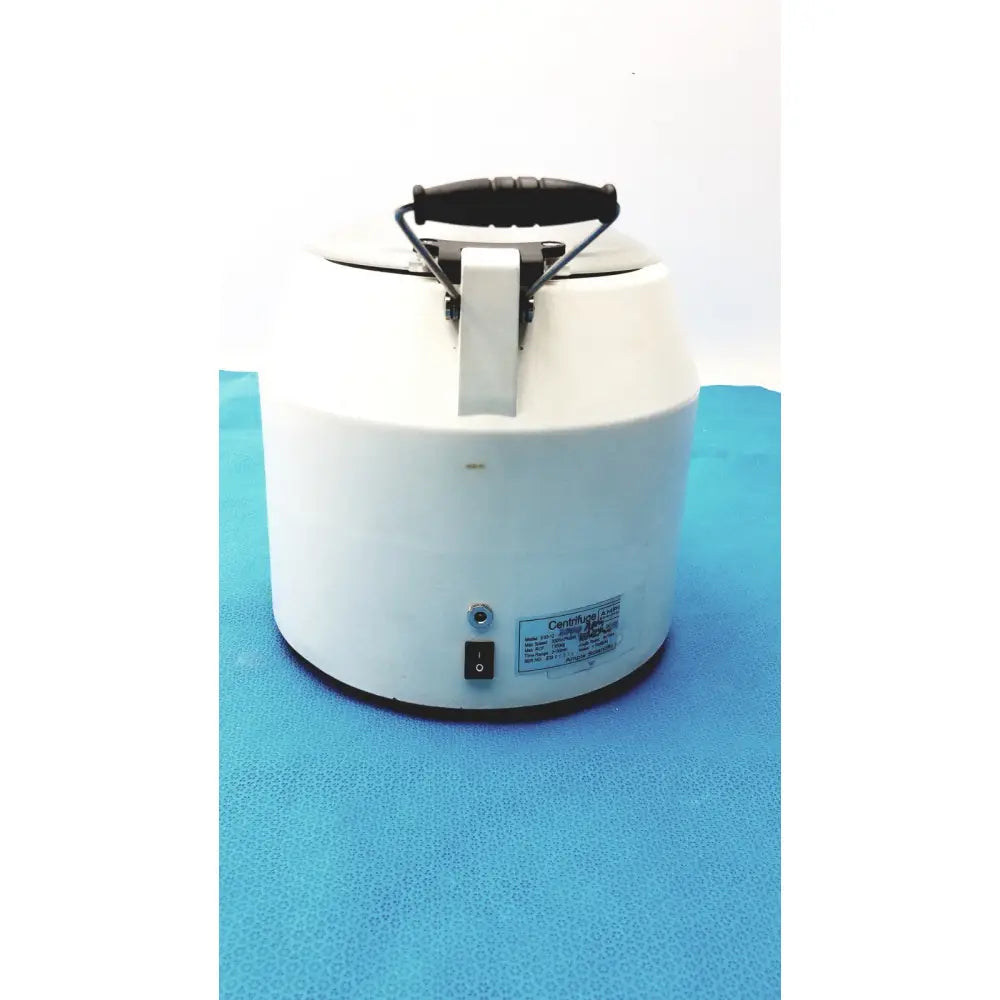 White cylindrical ample scientific champion centrifuge with black handle, metal latch, and side label model e33-12
