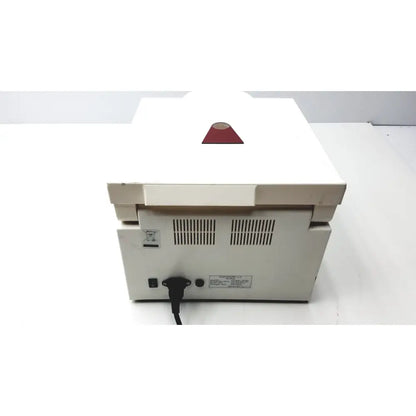 White ample scientific champion f-33d digital laboratory centrifuge with red indicator and ventilation slits on back panel