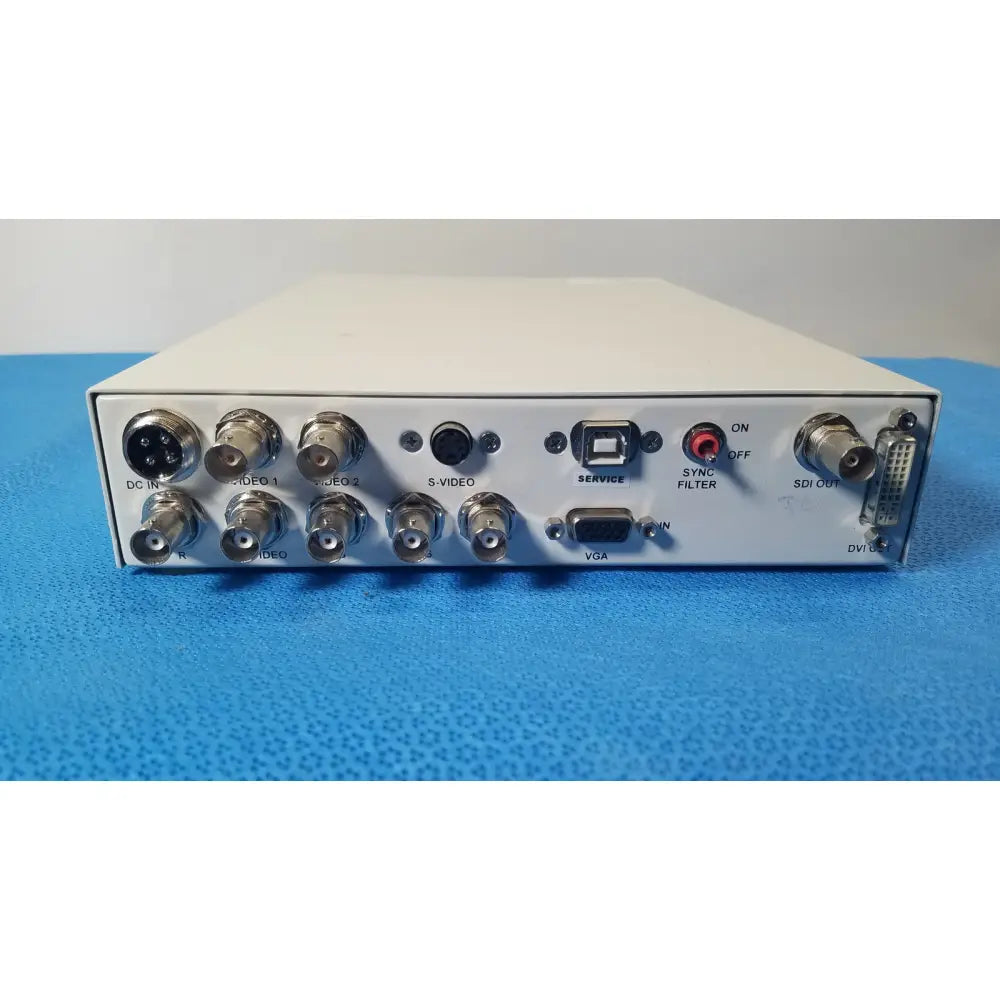 White rectangular ampronix scanmaxx ds2165mp medical video converter showing multiple bnc dvi usb vga and sdi ports back view