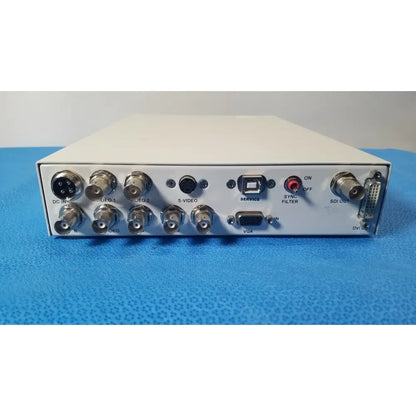 White rectangular ampronix scanmaxx ds2165mp medical video converter showing multiple bnc dvi usb vga and sdi ports back view