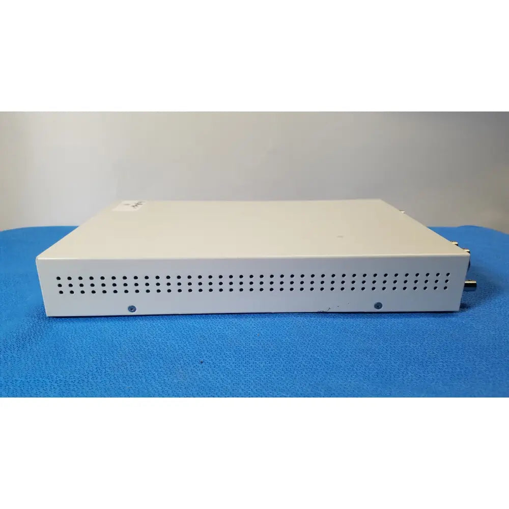 White rectangular ampronix scanmaxx ds2165mp medical video converter with perforated front panel and side metallic connectors