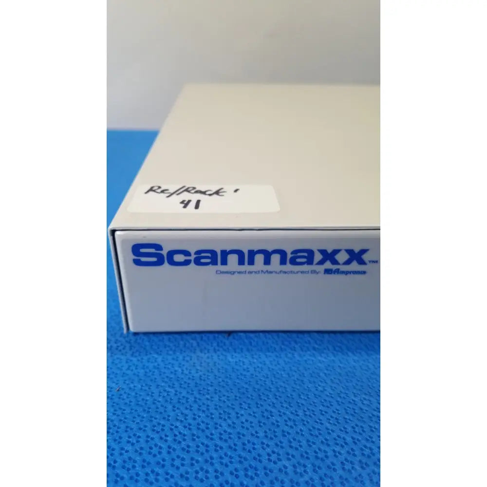 White scanmaxx ds2165mp medical video converter box with blue branding and handwritten label by ampronix