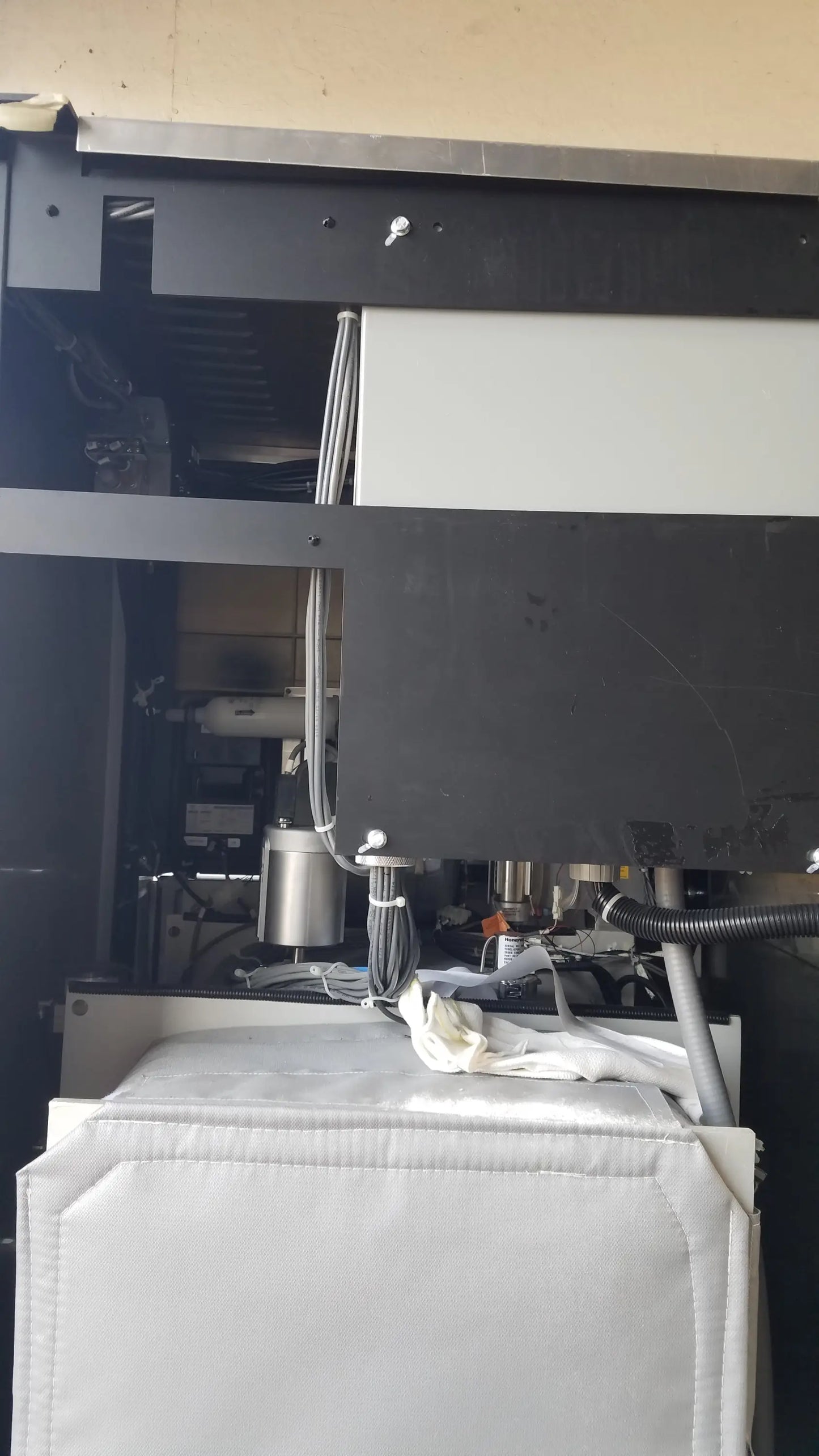 Black AMSCO Steris V-Pro Max low temperature sterilization system with metallic components and white padded sections