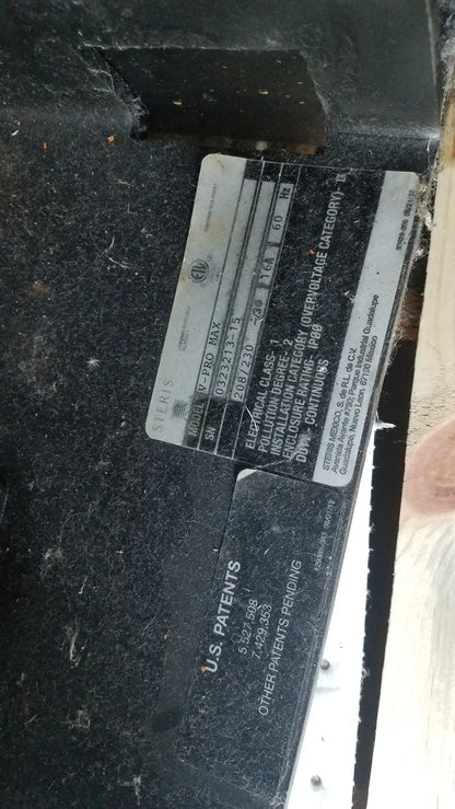 Black metal electrical panel label with white text and silver siemens logo on amsco steris v-pro max low temperature sterilization system