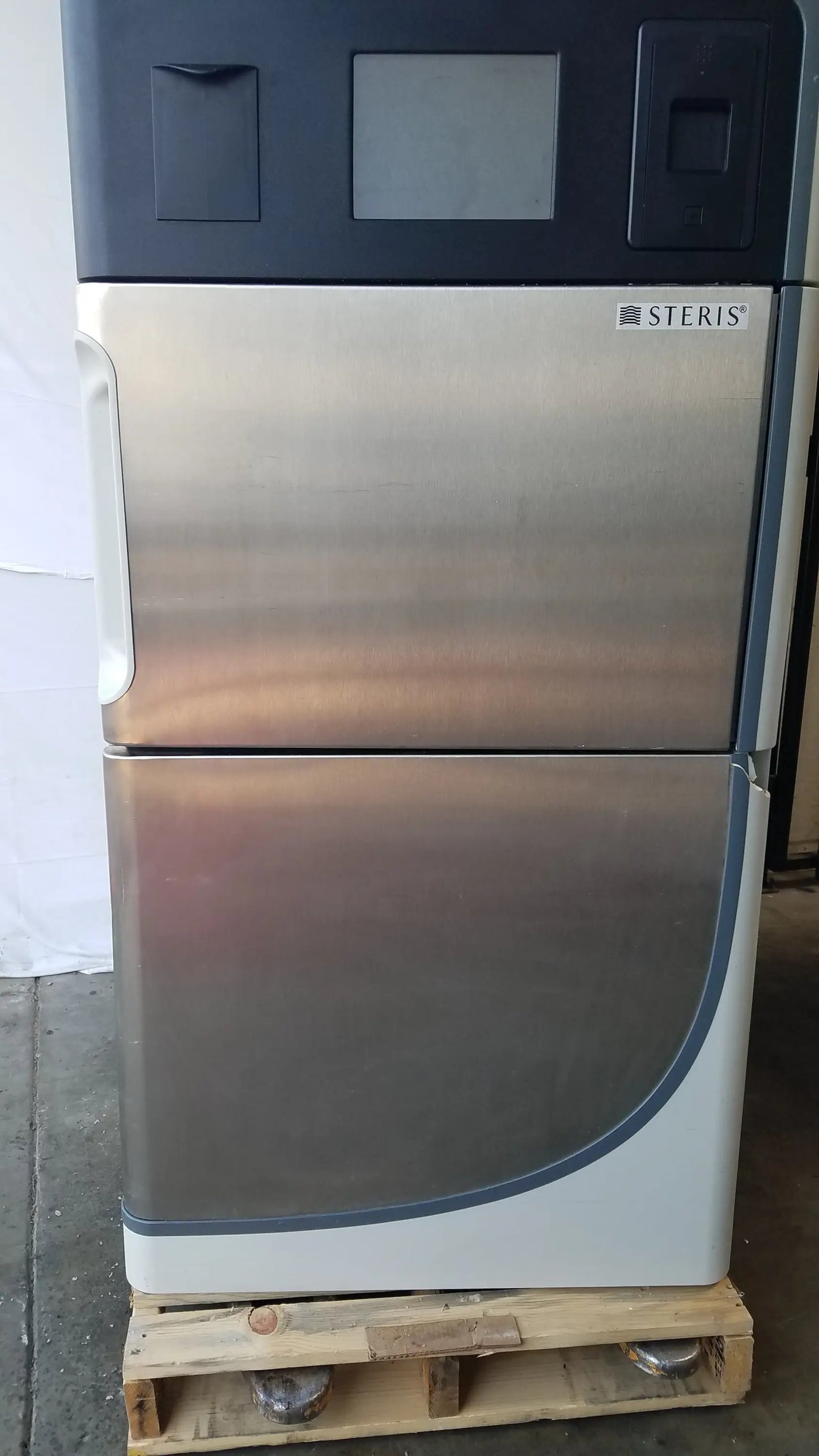 Amsco steris v-pro max low temperature sterilization system stainless steel unit with dark gray top and curved lower section
