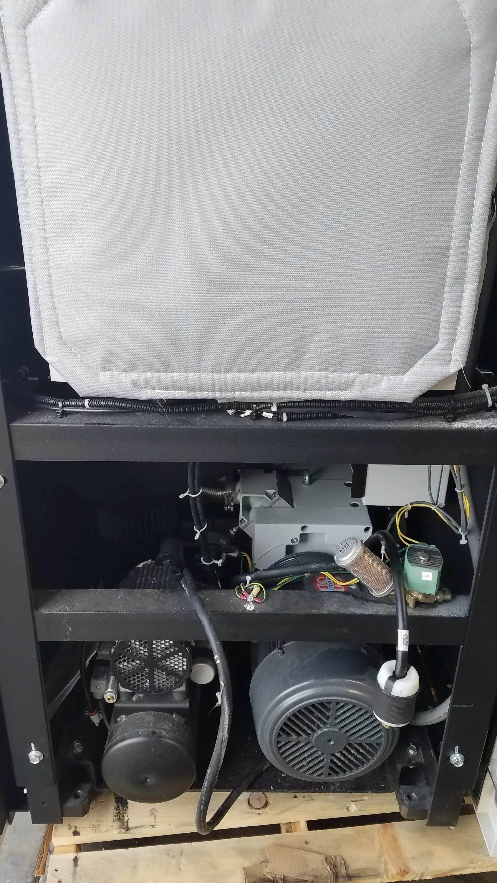 White padded cover over mechanical components and wiring on the back side of amsco steris v-pro max low temperature sterilization system