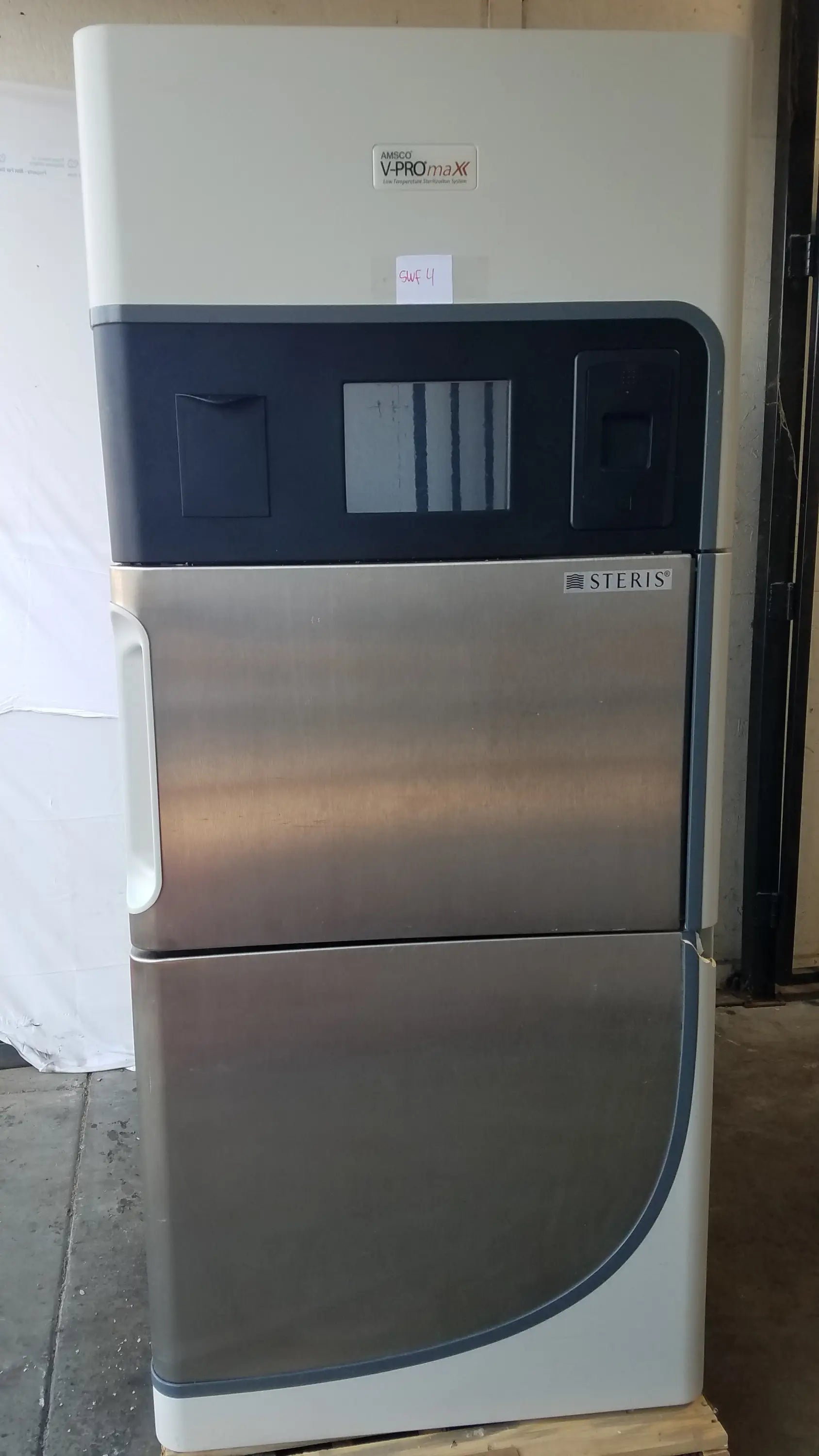 Amsco Steris V-Pro Max low temperature sterilization system with stainless steel front panel and beige upper section