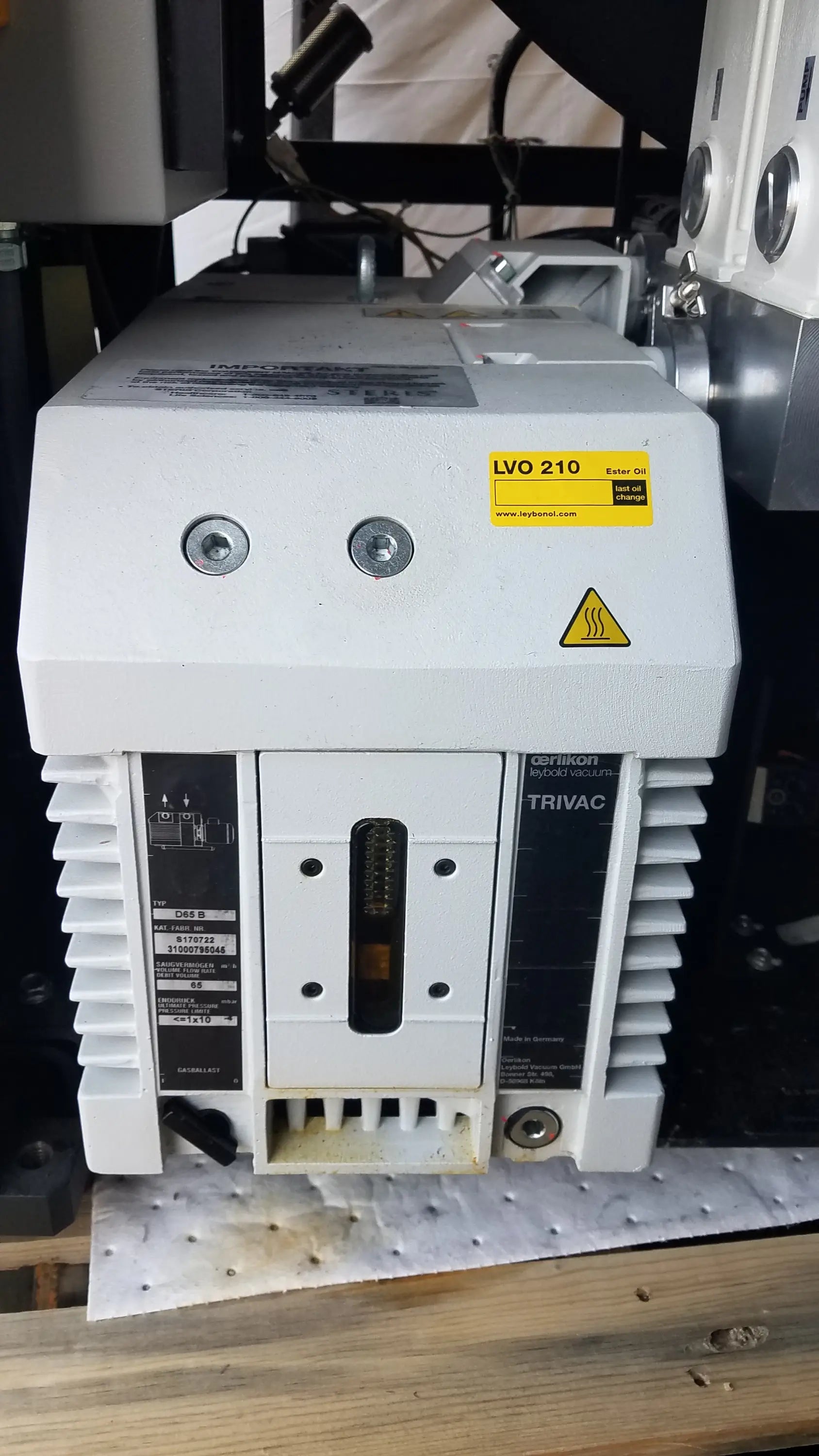 White trivac industrial motor controller with yellow warning label and black panels for v-pro max low temperature sterilization system