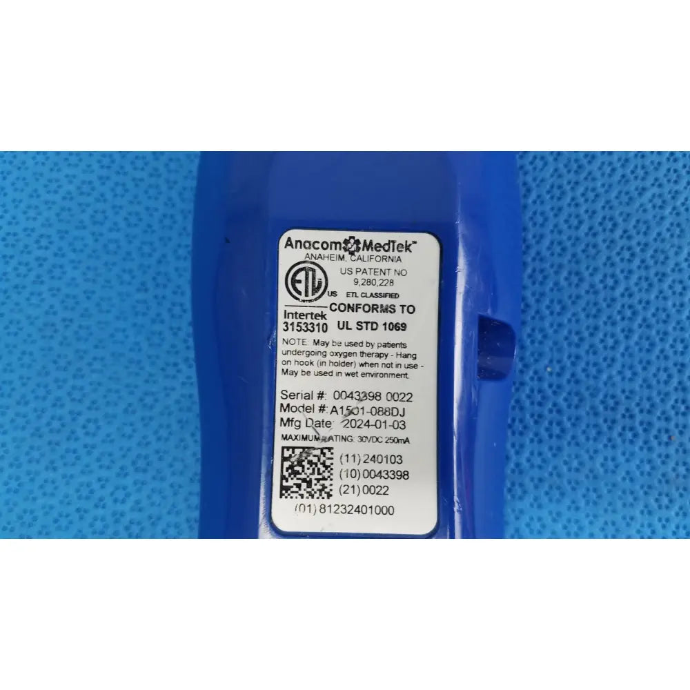 Blue plastic anacom medtek a1501-088dj remote handset with white label showing manufacturer and regulatory details