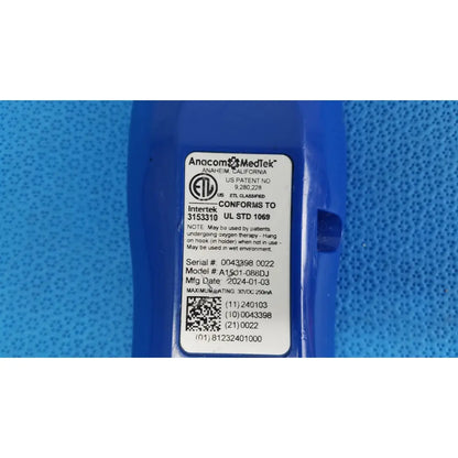 Blue plastic anacom medtek a1501-088dj remote handset with white label showing manufacturer and regulatory details