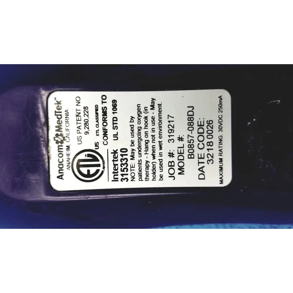 Anacom MedTek b0857-088dj pillow speaker remote with white label and black text on dark purple medical device