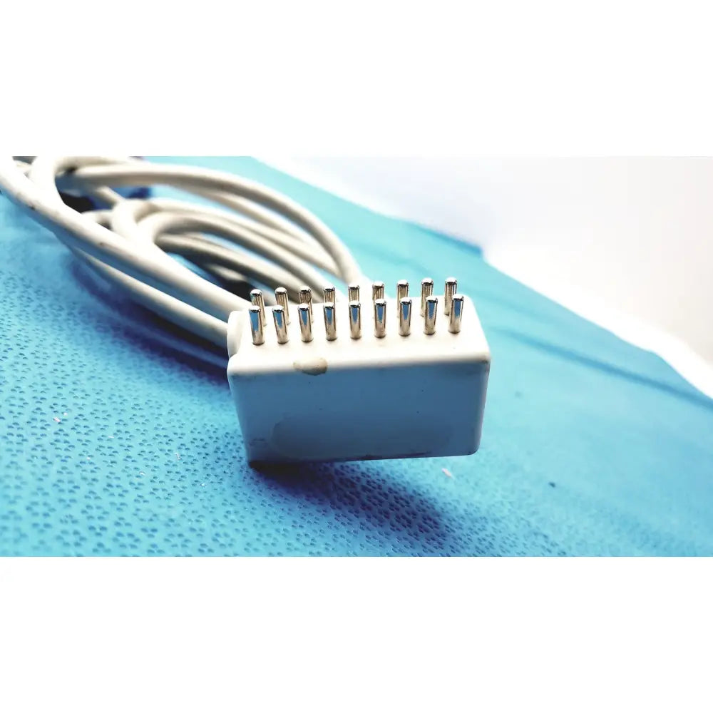 White plastic connector with ten metallic pins on the back of anacom medtek b0857-088dj pillow speaker remote