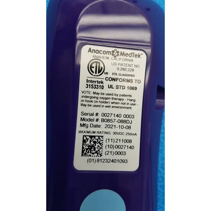 Purple plastic anacom medtek b0857-088dj pillow speaker remote with white label showing model and safety certifications