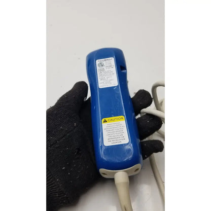 Blue plastic handheld electrical tester with white cable and warning labels for anacom medtek a1501-088dj pillow speaker remote
