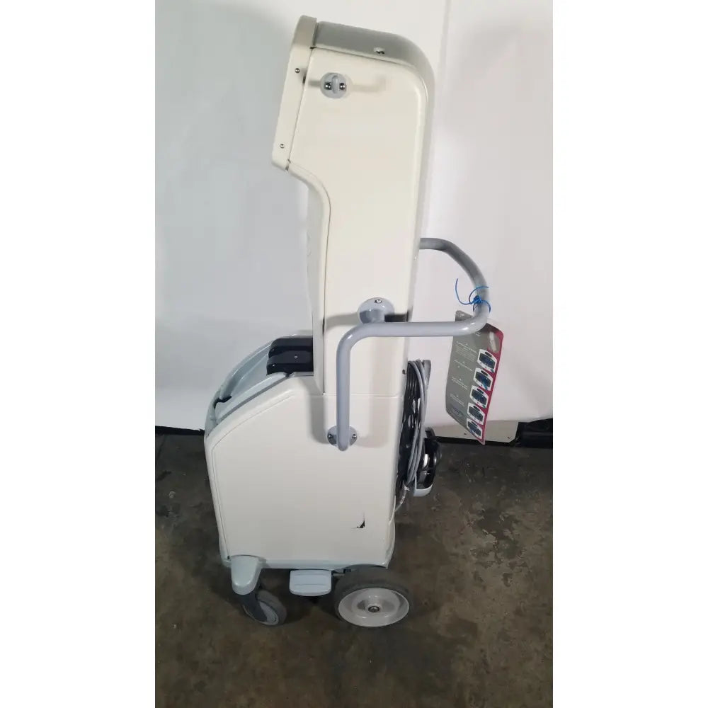 Cream-colored angiojet ultra thrombectomy system console 5000a with gray handle and wheels featuring modern design