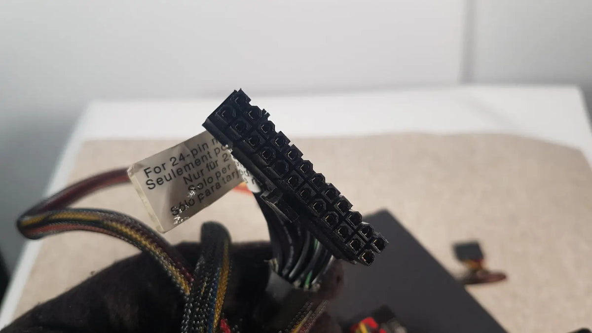 Black 24-pin power connector with label for 24-pin motherboards on antec truepower 550w black switching power supply