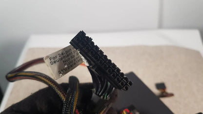 Black 24-pin power connector with label for 24-pin motherboards on antec truepower 550w black switching power supply