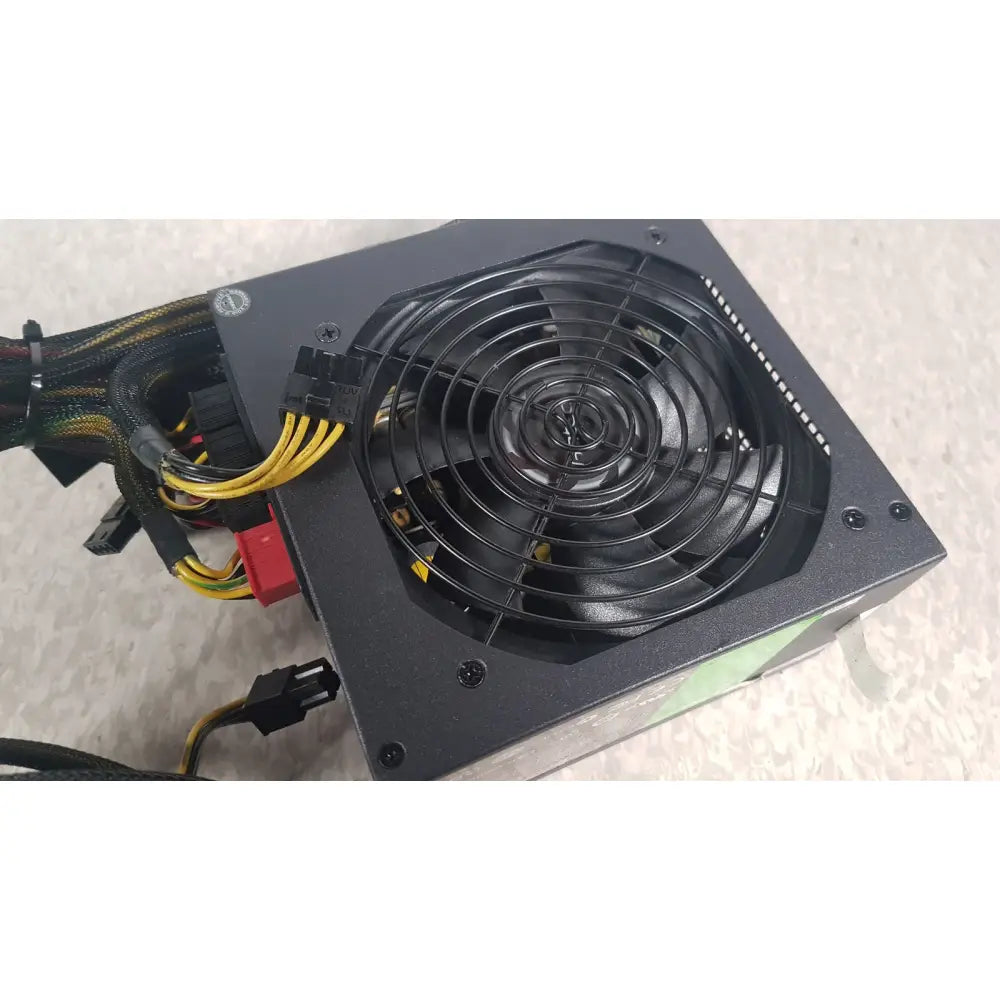 Black rectangular computer power supply unit with circular fan and cables in the antec truepower 550w black model