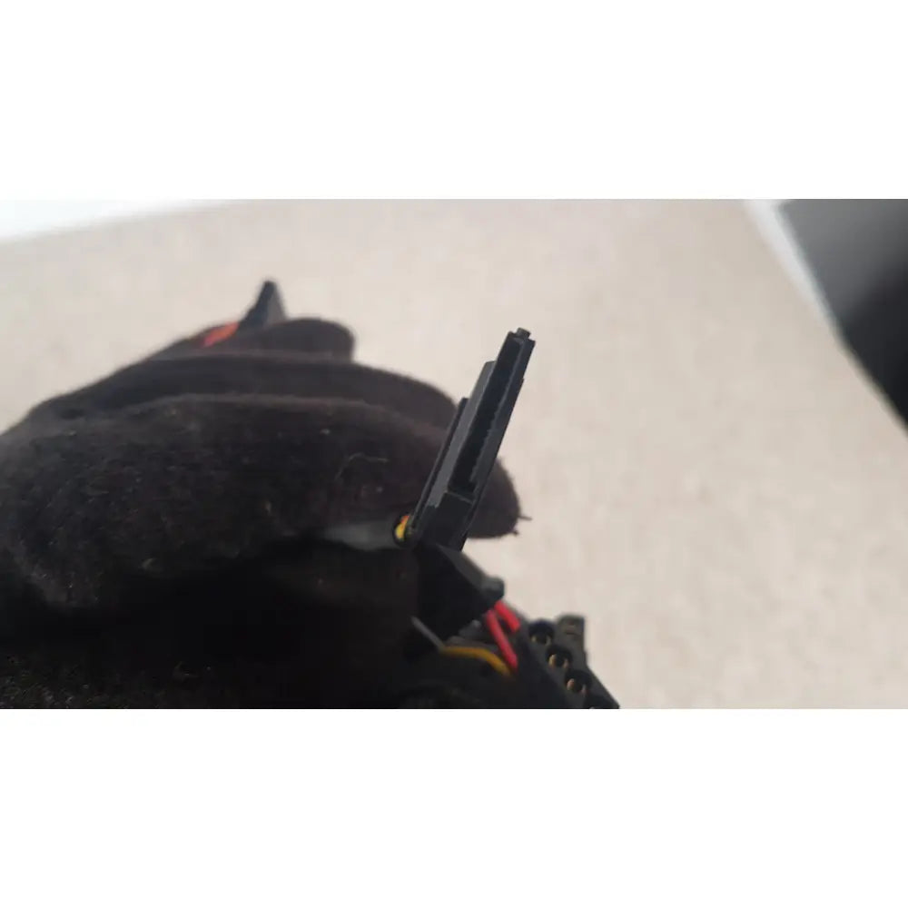 Black plastic sata power connector with red and yellow wires attached to antec truepower 550w black switching power supply