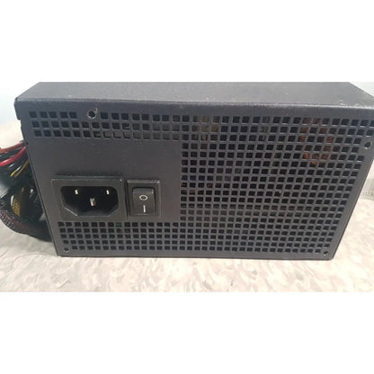Black rectangular truepower 550w power supply with perforated metal casing ac input port and on/off switch backside view