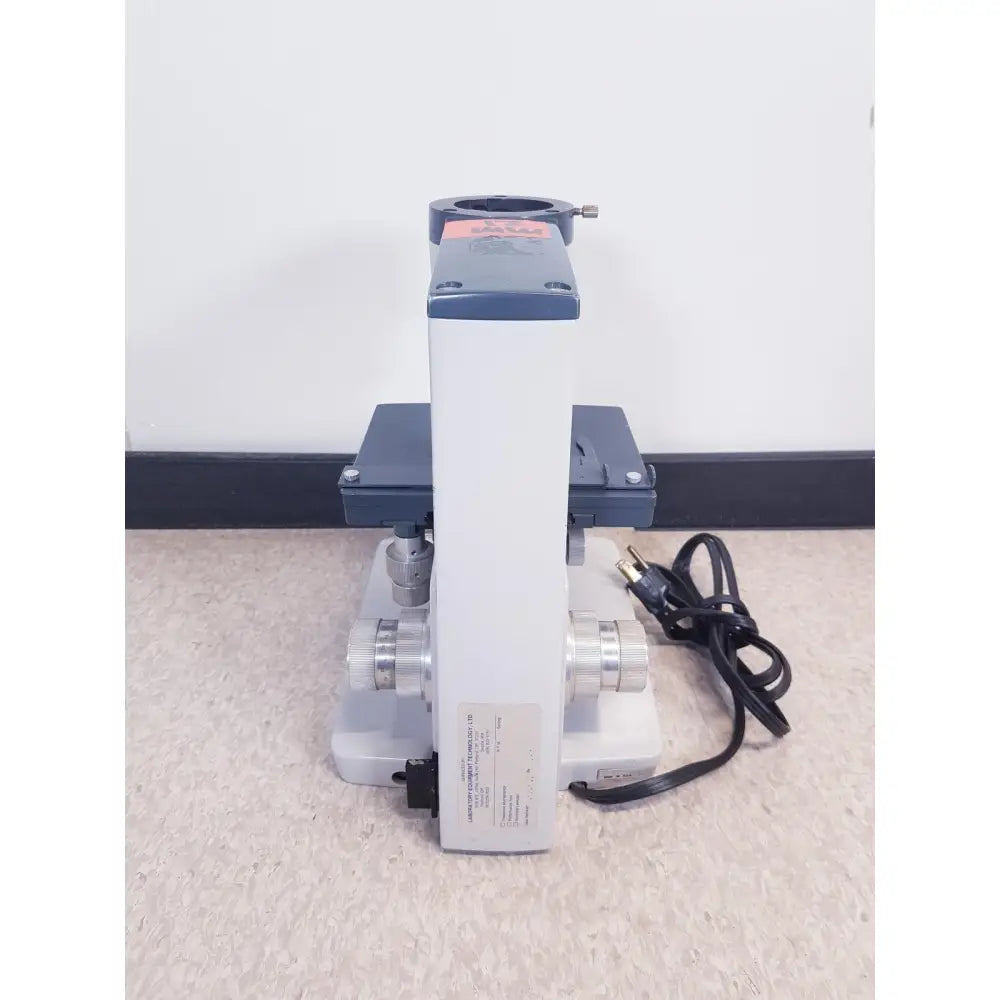 Gray and white compound microscope with metallic components from ao scientific instruments one-ten illuminator model 1130a