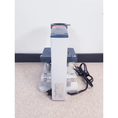 Gray and white compound microscope with metallic components from ao scientific instruments one-ten illuminator model 1130a
