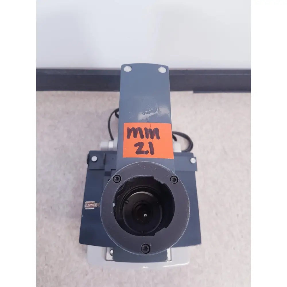Dark gray industrial camera lens mount with orange mm 2.1 label on top for ao scientific instruments one-ten illuminator model 1130a