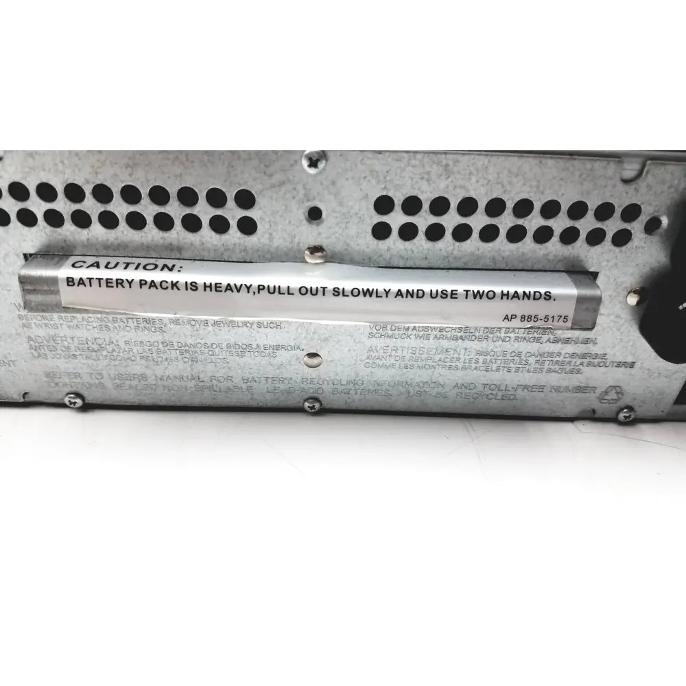 Silver metallic battery pack with black ventilation holes and caution label on the back of schneider electric smart-ups smt1000rm2u