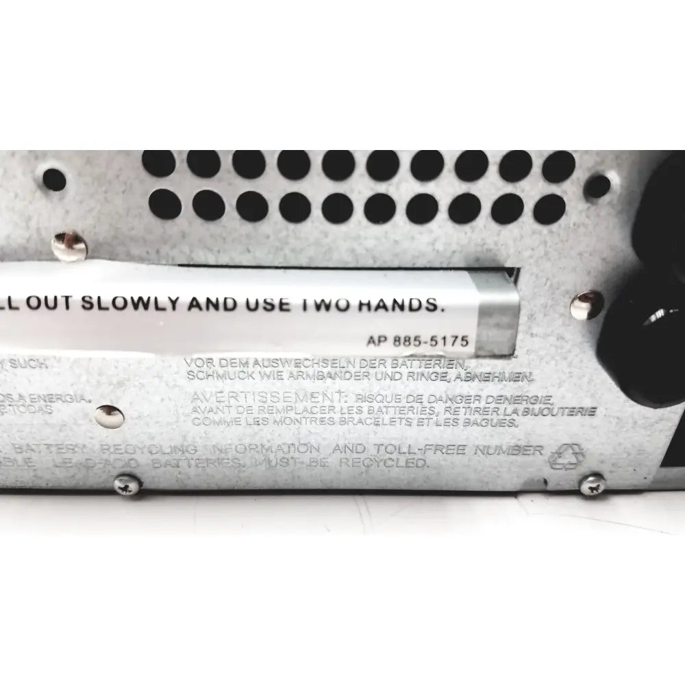 Silver metallic battery compartment label with multilingual safety instructions on the back of schneider electric smart-ups smt1000rm2u