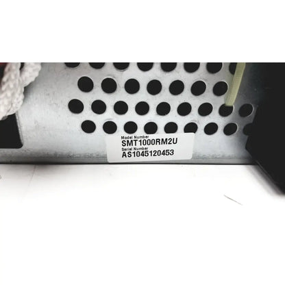 Silver perforated metal server chassis with model smt1000rm2u label from schneider electric smart-ups smt1000rm2u