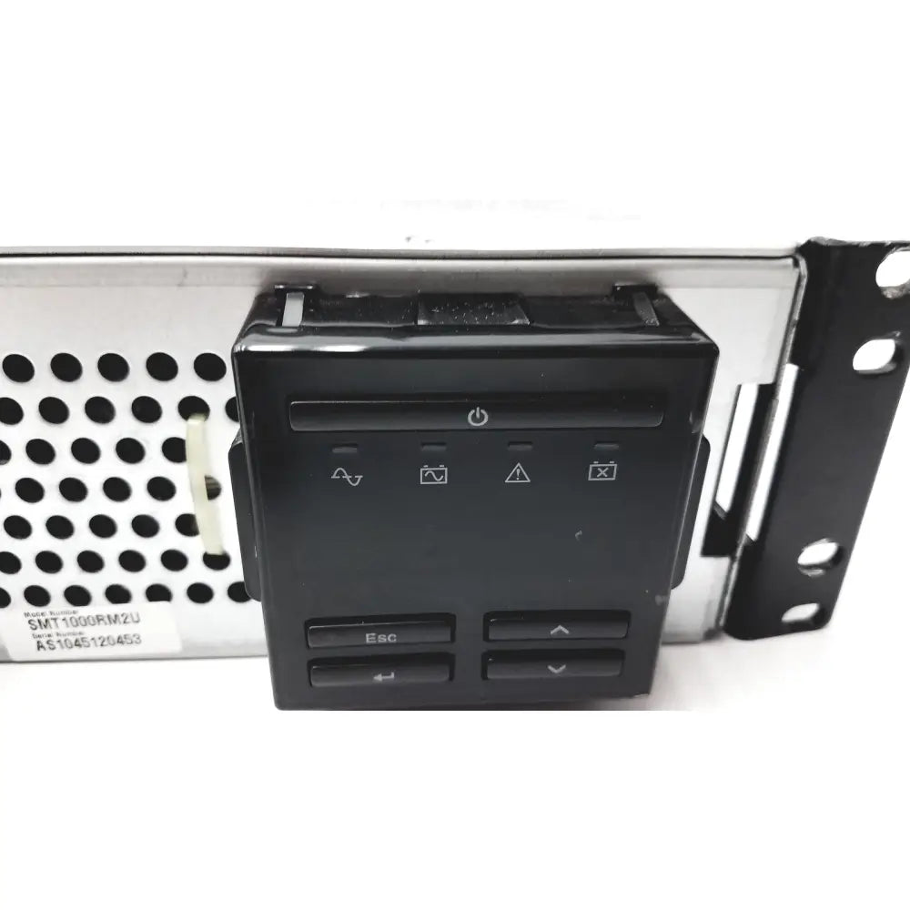 Black plastic control panel with power button and function icons on schneider electric smart-ups smt1000rm2u unit