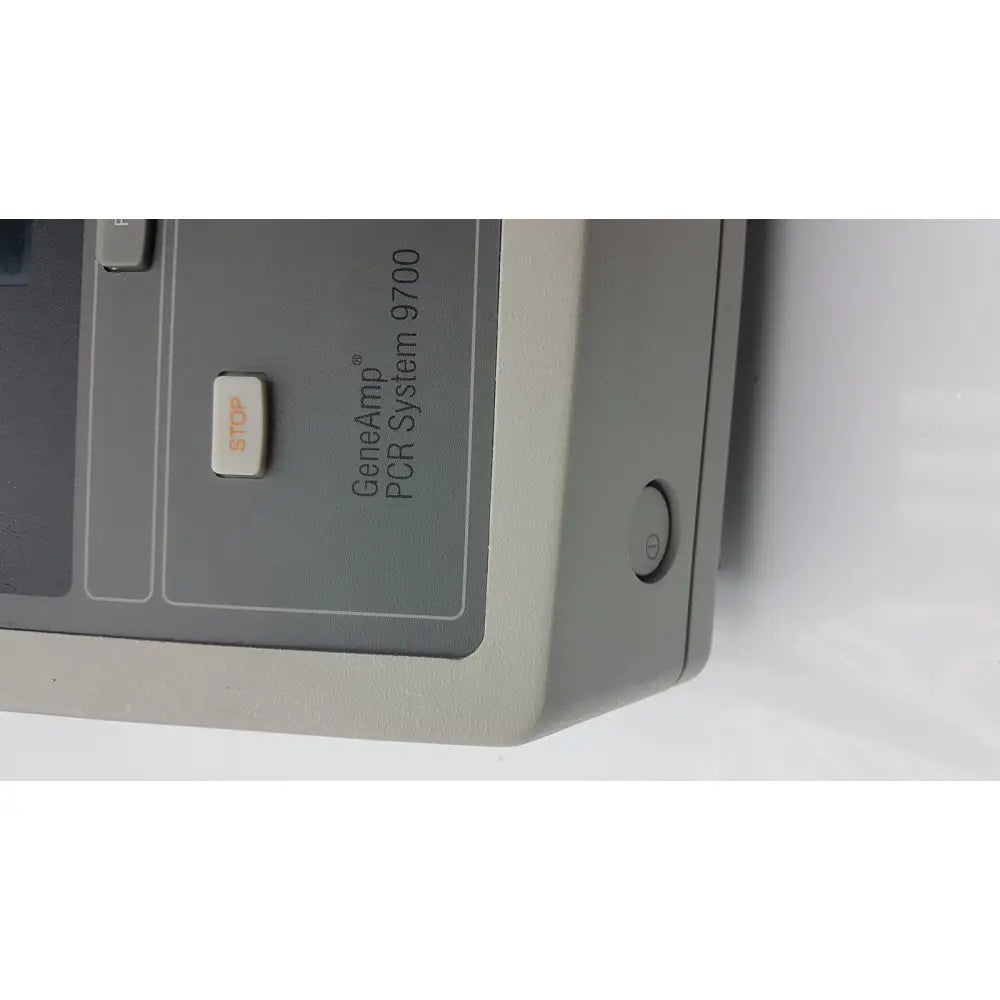 Applied biosystem geneamp pcr system 9700 with gray casing, white stop button, and power indicator for precise amplification