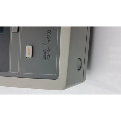 Applied biosystem geneamp pcr system 9700 with gray casing, white stop button, and power indicator for precise amplification
