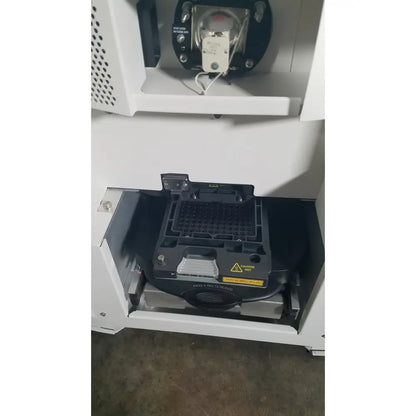 Black plastic sample tray with grid wells and warning label for applied biosystems quantstudio real-time pcr instrument