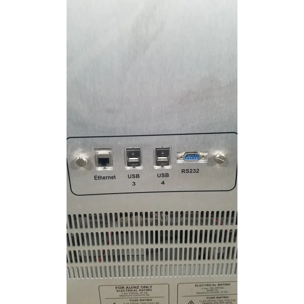 Silver metallic server rack with labeled ethernet usb 3 usb 4 and rs232 ports on back of applied biosystems quantstudio dx instrument