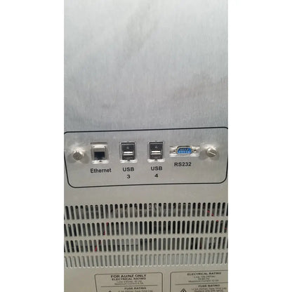 Silver metallic server rack with labeled ethernet usb 3 usb 4 and rs232 ports on back of applied biosystems quantstudio dx instrument
