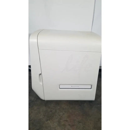 White plastic applied biosystems quantstudio dx real-time pcr instrument with subtle life logo on front panel