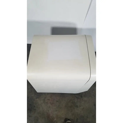 Cream-colored rectangular plastic box with smooth finish and rounded edges on applied biosystems quantstudio dx instrument
