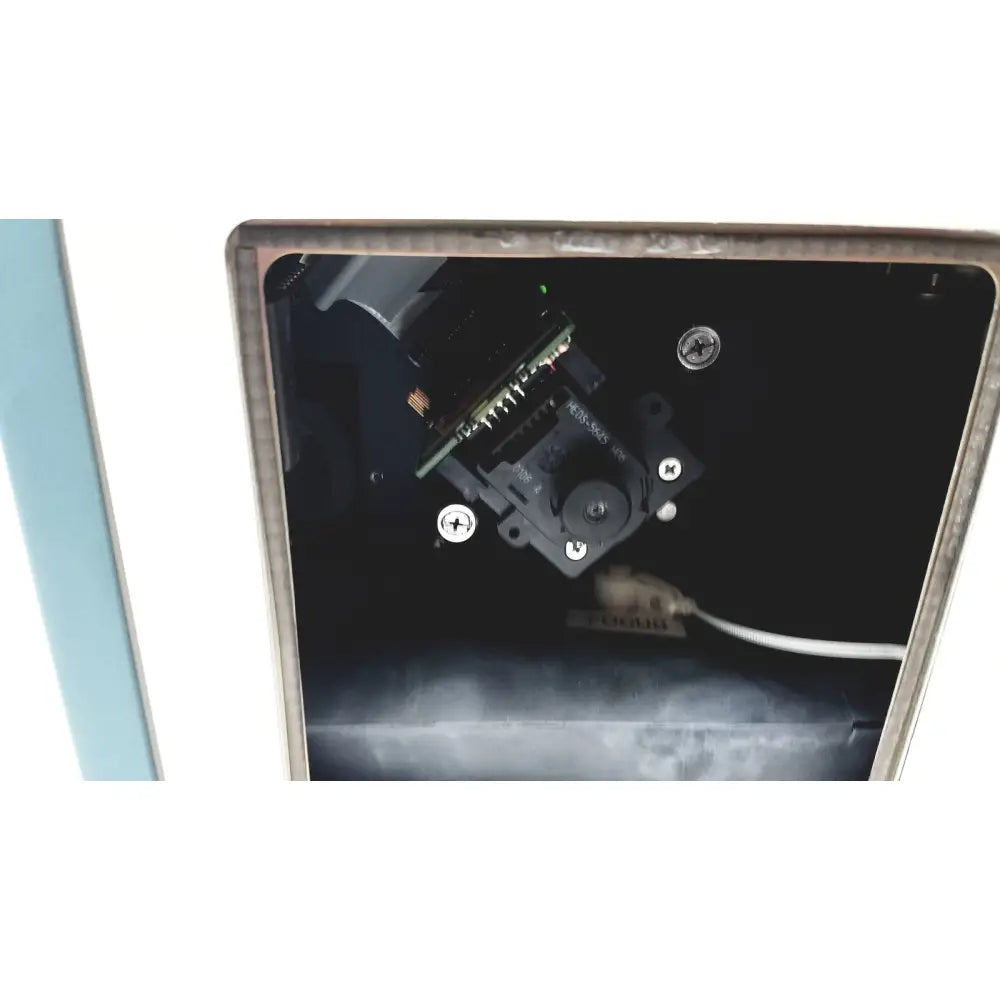Applied precision introduces black arrayworxe biochip reader with silver screws and white cable attached for precision use
