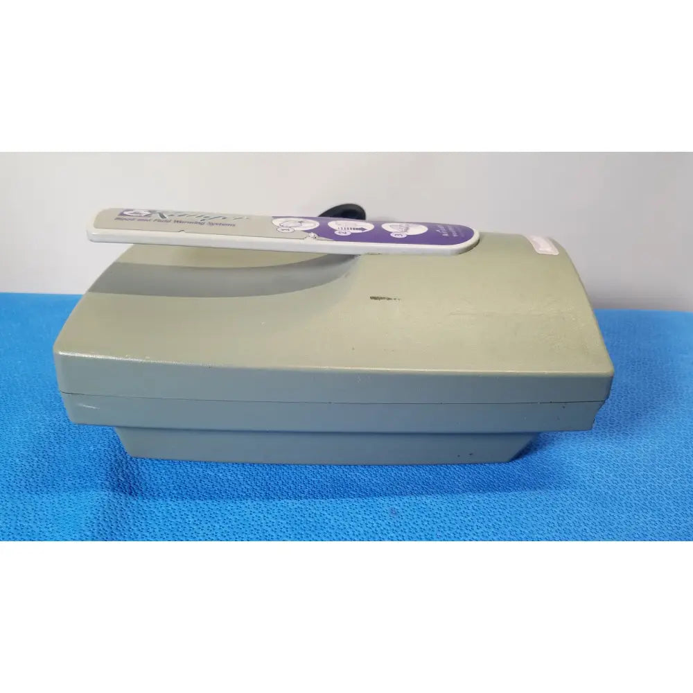 Beige plastic arizant healthcare ranger blood and fluid warming system model 245 with purple and white control panel