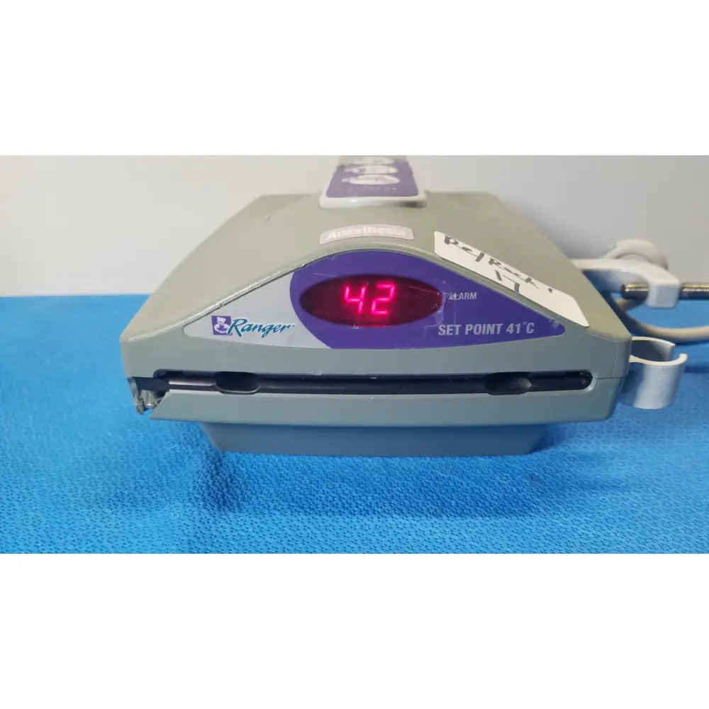 Gray medtronic ranger medical device with digital red numerals and purple accents in arizant healthcare ranger fluid warming system